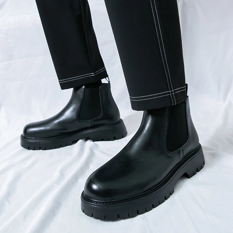 Brown Chelsea leather boots by MALEVA featuring classic ankle-height design and elastic side panels.