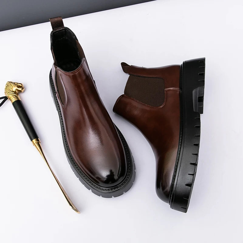 Brown MALEVA Chelsea leather boots with elastic side panels and rounded toes, displayed on a neutral background.