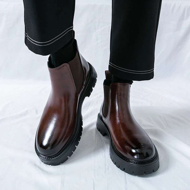 Brown MALEVA Chelsea leather boots with elastic side panels and rounded toes, styled for a classic, versatile look.