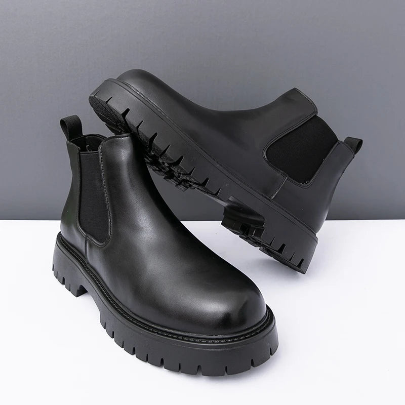 Brown MALEVA Chelsea leather boots with elastic side panels and rounded toes, stylish footwear for casual or formal wear.