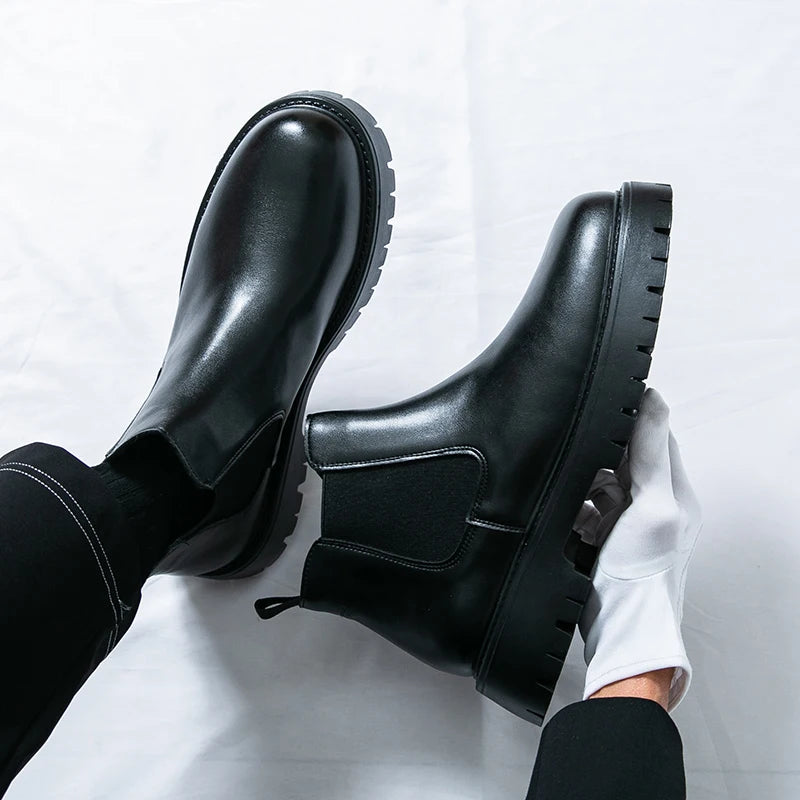 Brown MALEVA Chelsea leather boots with elastic side panels and a sleek, classic design, perfect for stylish casual wear.