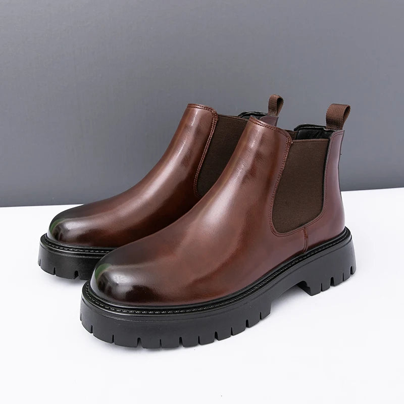 Brown Chelsea leather boots by MALEVA featuring ankle height, elastic side panels, and sleek design for versatile style.